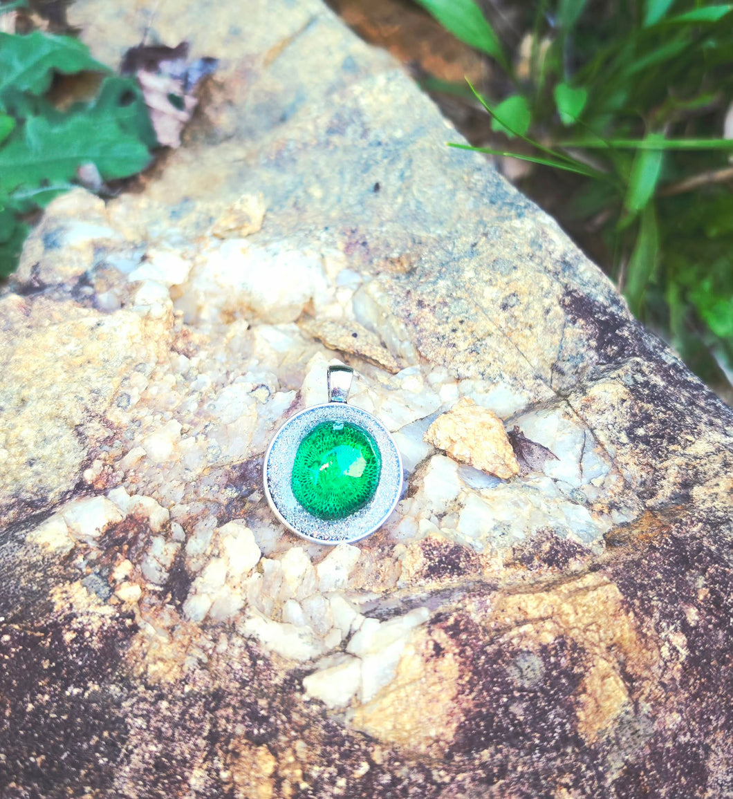 2.75 Carat real emerald. Medium quality, set in a Turkish .999 base with design on back, filled with liquid silver and resin.